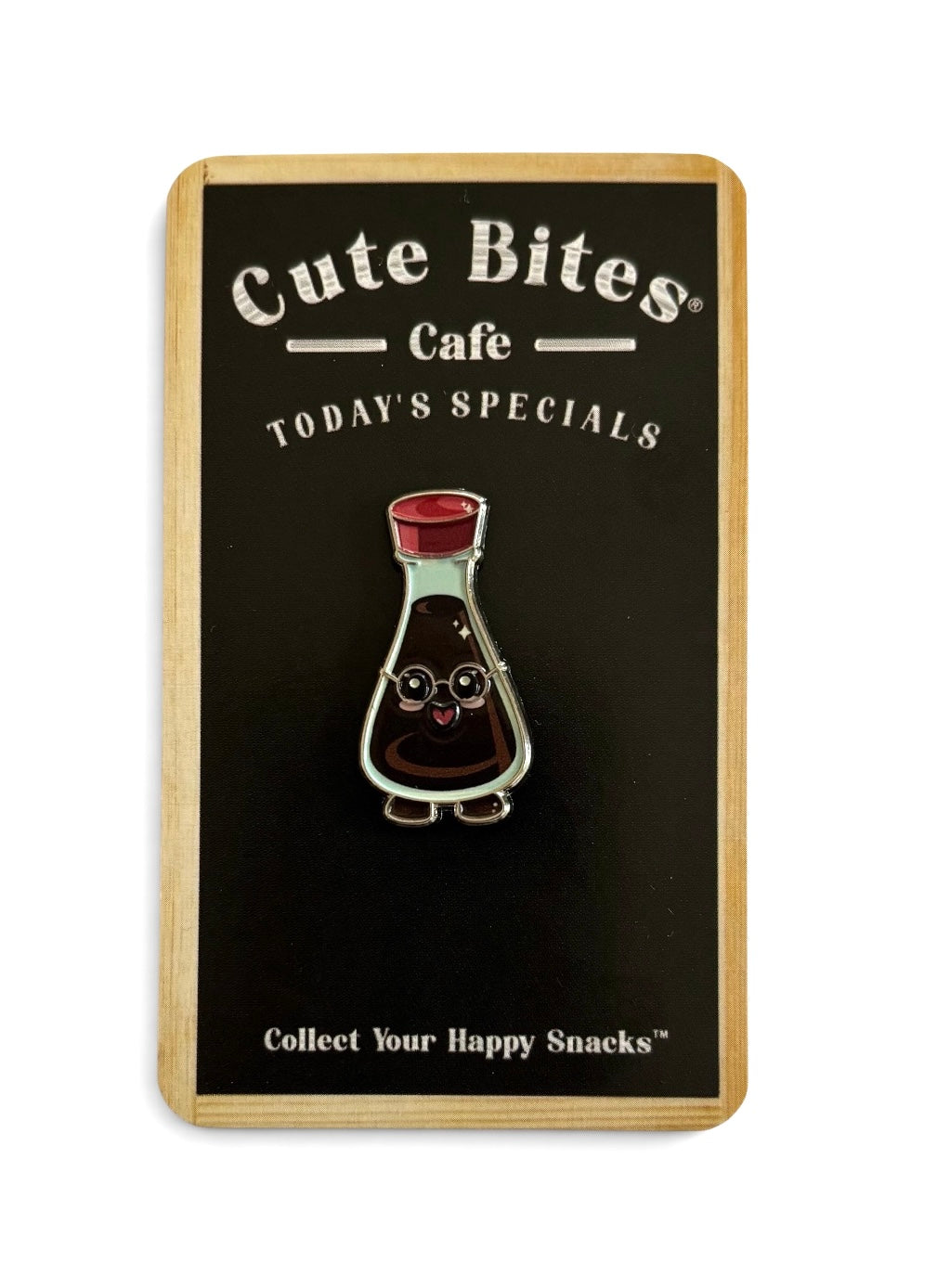 A cute smart soy enamel pin with a smiling face, displayed on its original backing card. The card features the text 'Cute Bites Cafe' and 'TODAY'S SPECIALS'.